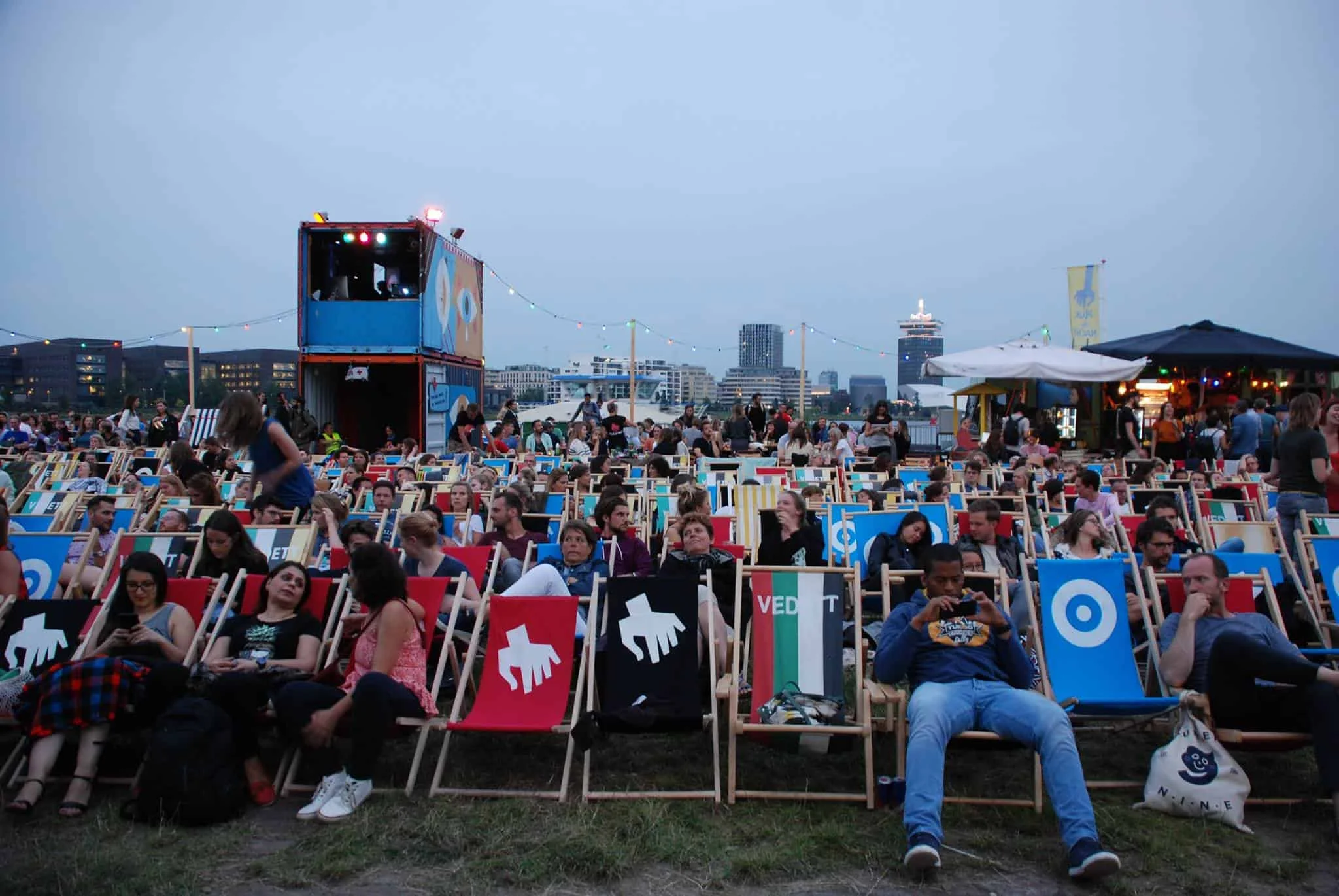 Pluk de Nacht outdoor cinema with a large screen built into a temporary shipping container structure