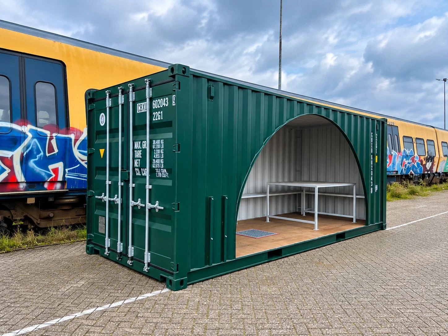 side opening, benches and table inside the JOP container