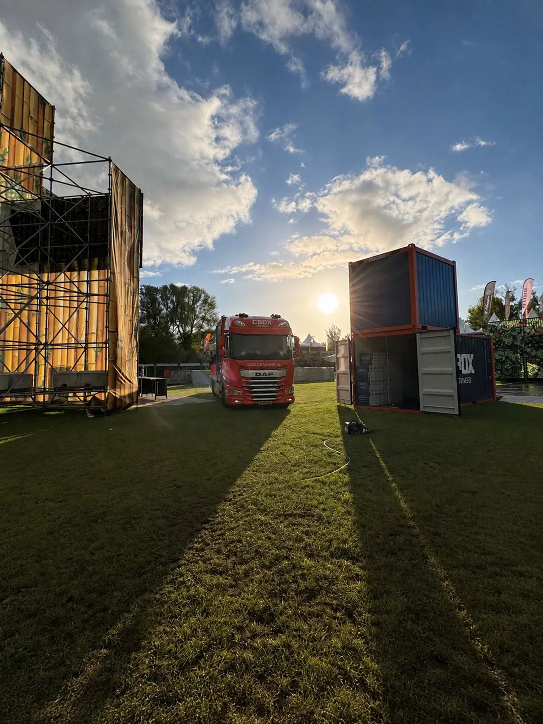 Stacked shipping containers in a logistics yard